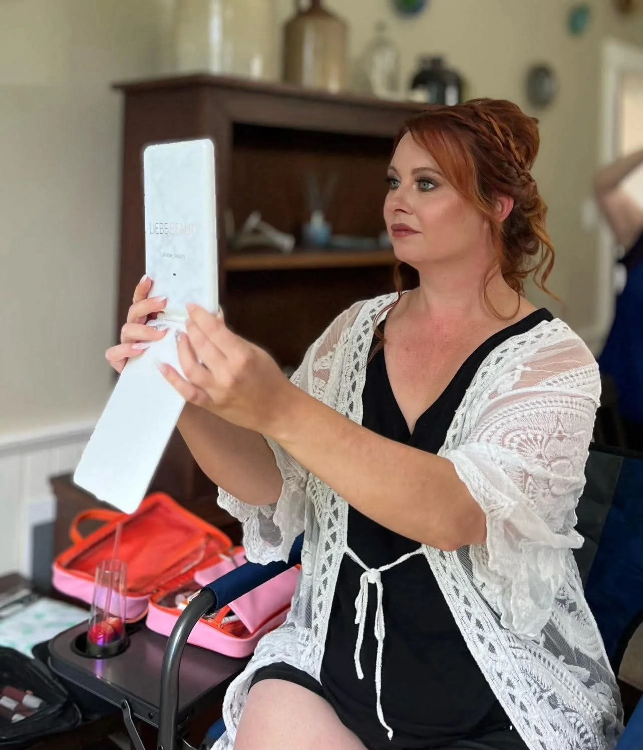 Red-haired client with bridal makeup