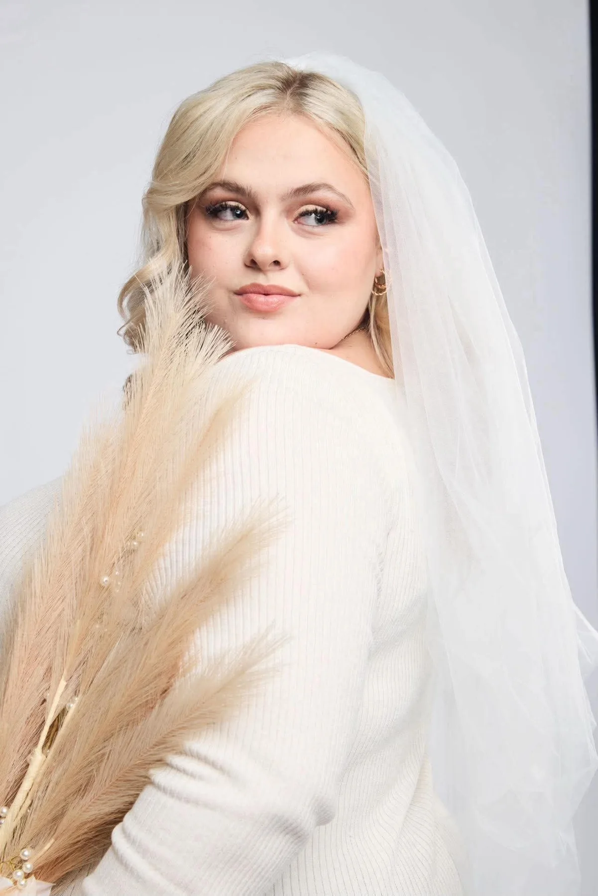Bride wearing soft romantic makeup and veil